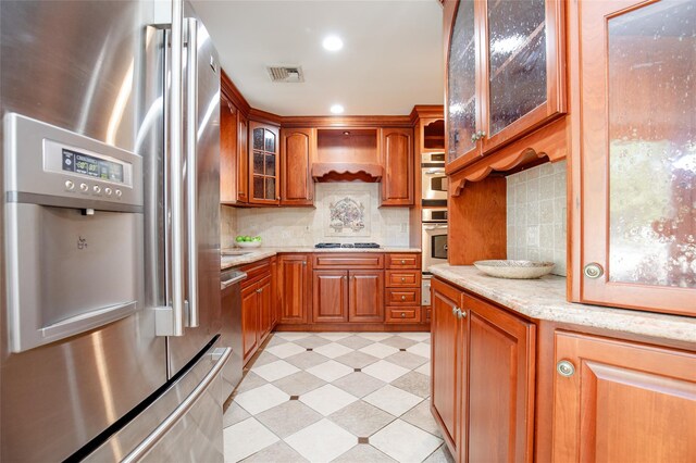48 Zugibe Ct, West Haverstraw, NY 10993 - kitchen featuring stainless steel refrigerator with ice dispenser, brown cabinets, glass insert cabinets, premium range hood, and recessed lighting