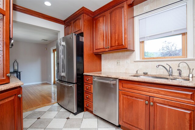 48 Zugibe Ct, West Haverstraw, NY 10993 - kitchen with appliances with stainless steel finishes, a sink, tasteful backsplash, light stone counters, and brown cabinets