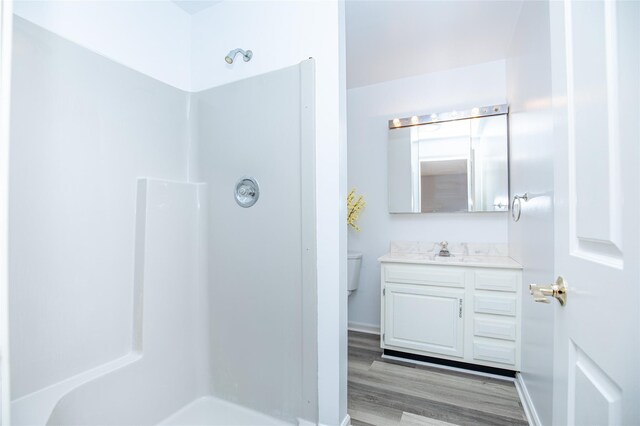 48 Zugibe Ct, West Haverstraw, NY 10993 - bathroom with toilet, a shower, vanity, and wood finished floors