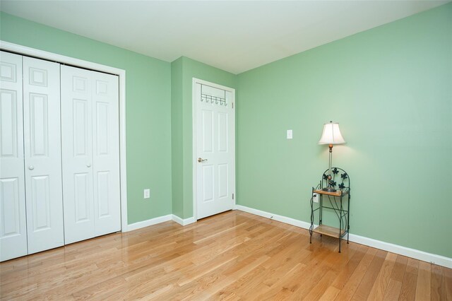 48 Zugibe Ct, West Haverstraw, NY 10993 - unfurnished bedroom with light wood finished floors, baseboards, and a closet