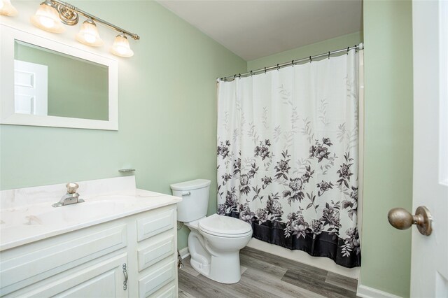 48 Zugibe Ct, West Haverstraw, NY 10993 - bathroom featuring toilet, vanity, wood finished floors, and curtained shower