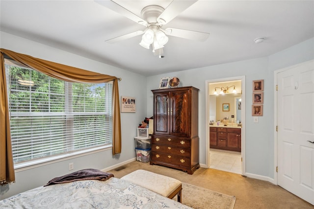 7 Yosemite Cir, Bohemia, NY 11716 - bedroom with light colored carpet, baseboards, ensuite bathroom, and a ceiling fan