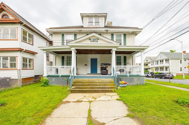 94 S Ave, Poughkeepsie, NY 12601 - traditional style home with a porch and a front yard
