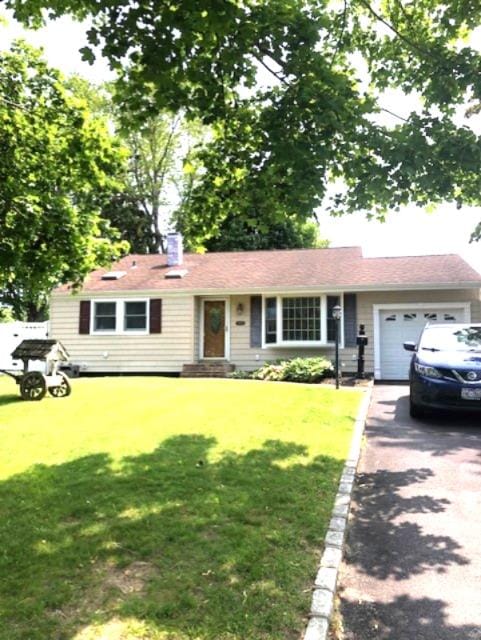 3003 Watch Hill Ave, Medford, NY 11763 - ranch-style home with driveway, a garage, a front lawn, and a chimney