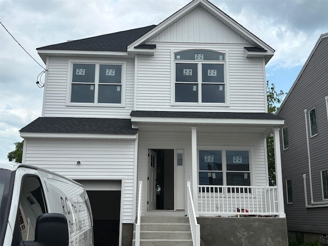 1108 Washington Pl, Baldwin Harbor, NY 11510 - view of front of house featuring a porch, an attached garage, and roof with shingles