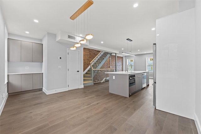 2118 45th Ave Unit 1And 2, Long Island City, NY 11101 - kitchen featuring gray cabinetry, modern cabinets, wood finished floors, dishwasher, and recessed lighting