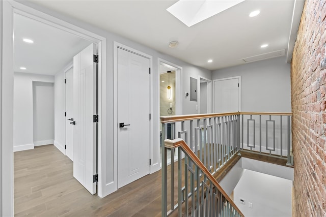 2118 45th Ave Unit 1And 2, Long Island City, NY 11101 - hallway with an upstairs landing, wood finished floors, recessed lighting, a skylight, and electric panel