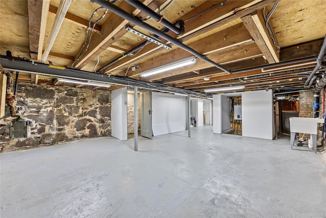 2118 45th Ave Unit 1And 2, Long Island City, NY 11101 - unfinished below grade area with tankless water heater and a sink