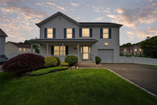 924 Otsego Ct, West Hempstead, NY 11552 - view of front of house with a garage, covered porch, and driveway
