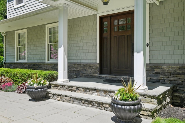 1 Highwoods Rd, Saint James, NY 11780 - property entrance with a porch and stone siding