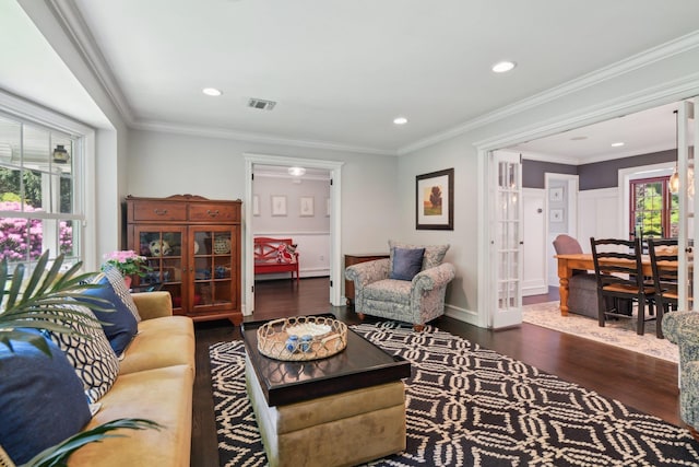 1 Highwoods Rd, Saint James, NY 11780 - living area featuring wood finished floors, healthy amount of natural light, crown molding, and recessed lighting