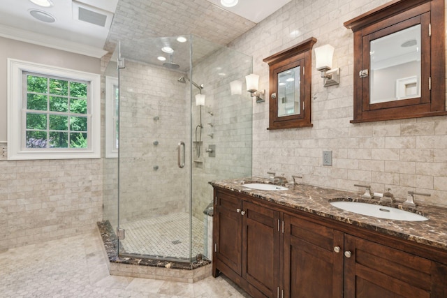 1 Highwoods Rd, Saint James, NY 11780 - bathroom with ornamental molding, a stall shower, double vanity, and tile walls