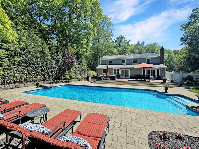 1 Highwoods Rd, Saint James, NY 11780 - view of swimming pool featuring a patio area, french doors, and a gate