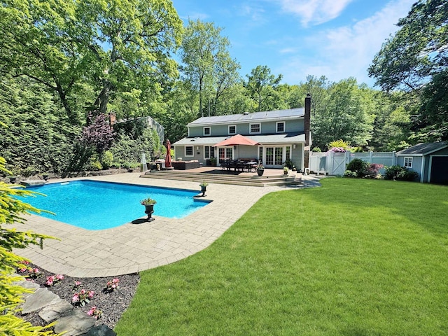 1 Highwoods Rd, Saint James, NY 11780 - view of pool with french doors, a patio, and view of wooded area