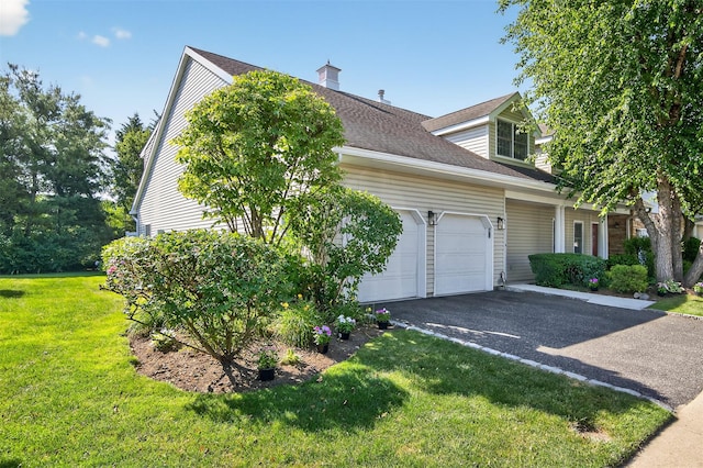 12 Miro Pl Unit 31, Port Washington, NY 11050 - view of home's exterior with an attached garage, driveway, a lawn, and a shingled roof