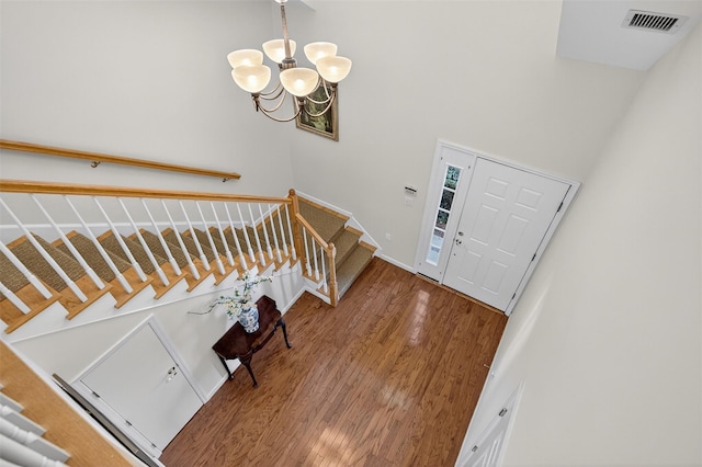 12 Miro Pl Unit 31, Port Washington, NY 11050 - foyer featuring a chandelier and wood finished floors