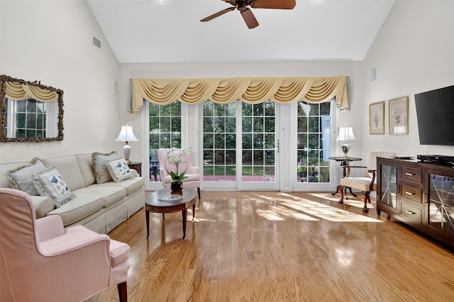 12 Miro Pl Unit 31, Port Washington, NY 11050 - living room featuring high vaulted ceiling, a ceiling fan, and wood finished floors