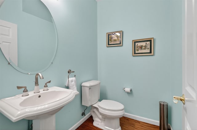 12 Miro Pl Unit 31, Port Washington, NY 11050 - half bath featuring baseboards and wood finished floors
