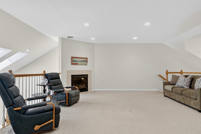 12 Miro Pl Unit 31, Port Washington, NY 11050 - living area with light colored carpet, a skylight, vaulted ceiling, recessed lighting, and a high end fireplace