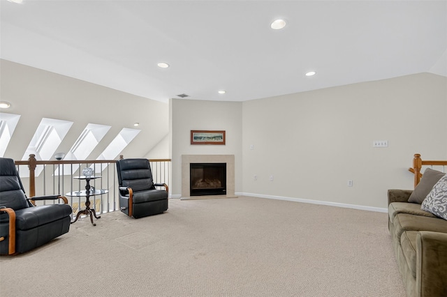 12 Miro Pl Unit 31, Port Washington, NY 11050 - carpeted living room featuring vaulted ceiling, a skylight, and recessed lighting