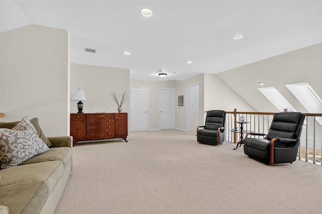 12 Miro Pl Unit 31, Port Washington, NY 11050 - living room featuring a skylight, light colored carpet, lofted ceiling, and recessed lighting