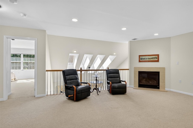 12 Miro Pl Unit 31, Port Washington, NY 11050 - living area featuring carpet, recessed lighting, a skylight, and a high end fireplace