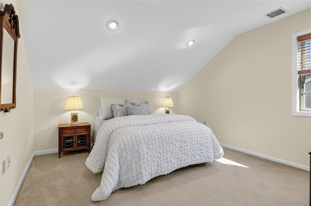 12 Miro Pl Unit 31, Port Washington, NY 11050 - carpeted bedroom featuring vaulted ceiling and baseboards