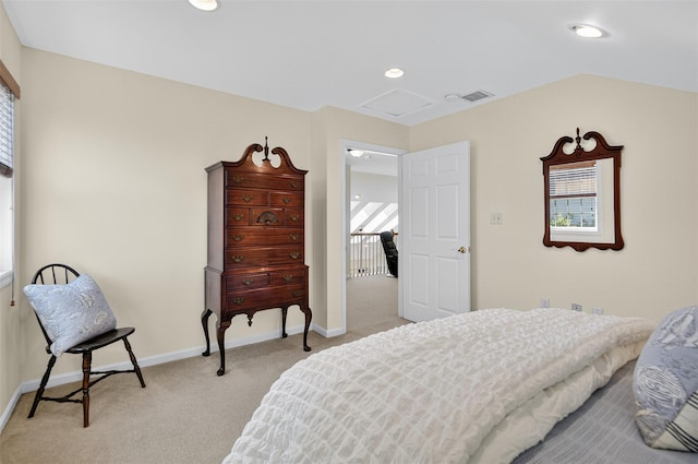 12 Miro Pl Unit 31, Port Washington, NY 11050 - bedroom with multiple windows, light carpet, attic access, and recessed lighting