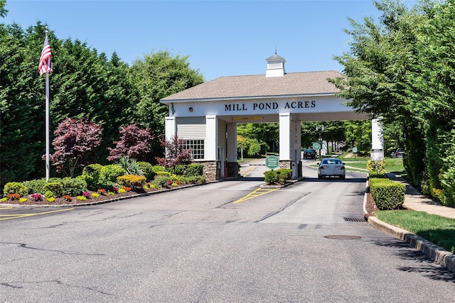 12 Miro Pl Unit 31, Port Washington, NY 11050 - view of asphalt road with curbs and a gated entry