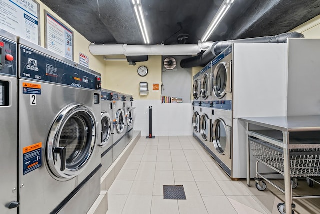 68-20 Selfridge St Unit 2F, Forest Hills, NY 11375 - community laundry room featuring stacked washer / drying machine, washing machine and clothes dryer, and tile patterned flooring