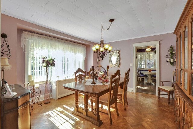 95-01 72nd Ave, Forest Hills, NY 11375 - dining space featuring plenty of natural light, a chandelier, and crown molding