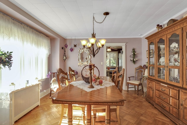 95-01 72nd Ave, Forest Hills, NY 11375 - dining space featuring a chandelier, radiator heating unit, and ornamental molding