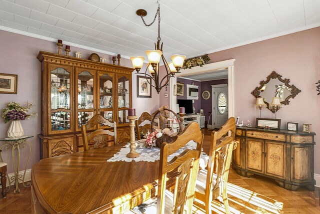 95-01 72nd Ave, Forest Hills, NY 11375 - dining space featuring a chandelier, ornamental molding, and baseboards