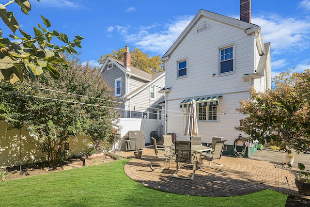95-01 72nd Ave, Forest Hills, NY 11375 - rear view of property featuring a patio area and a chimney