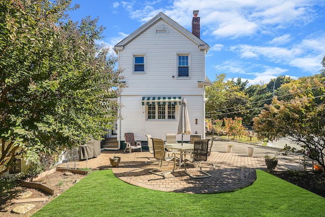 95-01 72nd Ave, Forest Hills, NY 11375 - rear view of house featuring a patio area, a chimney, and a lawn
