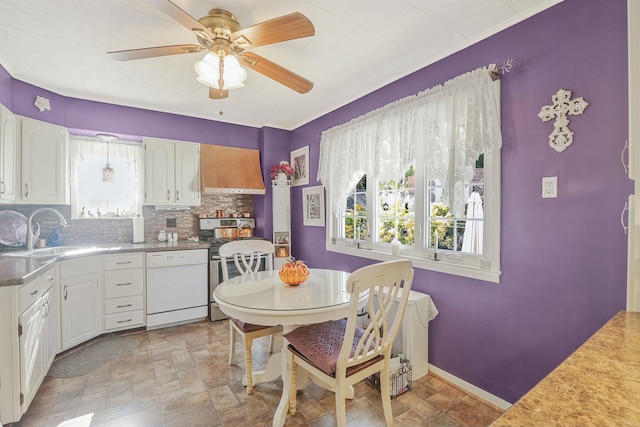 95-01 72nd Ave, Forest Hills, NY 11375 - dining room with light stone finish floors, a ceiling fan, and baseboards