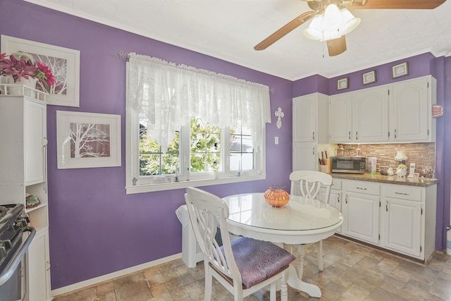 95-01 72nd Ave, Forest Hills, NY 11375 - dining area featuring stone finish flooring, ceiling fan, and baseboards