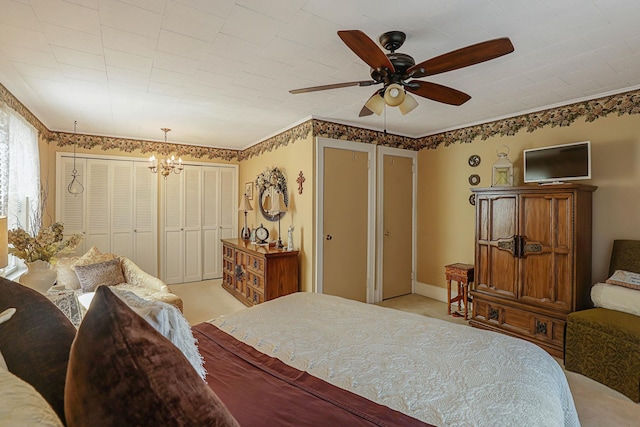 95-01 72nd Ave, Forest Hills, NY 11375 - bedroom with a chandelier, light colored carpet, multiple closets, and ceiling fan