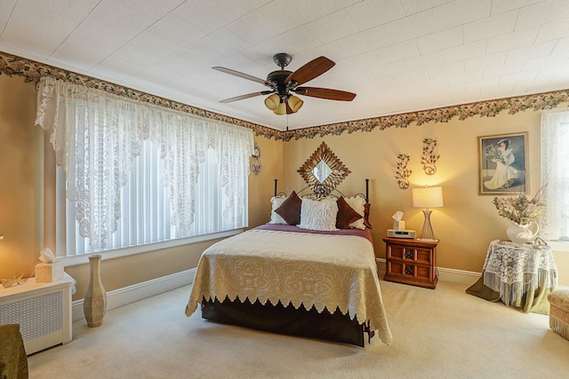 95-01 72nd Ave, Forest Hills, NY 11375 - bedroom featuring multiple windows, carpet, baseboards, and a ceiling fan