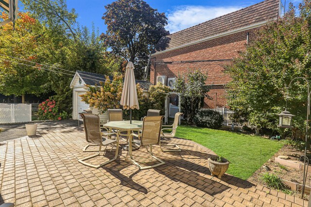 95-01 72nd Ave, Forest Hills, NY 11375 - view of patio featuring an outdoor structure and outdoor dining area