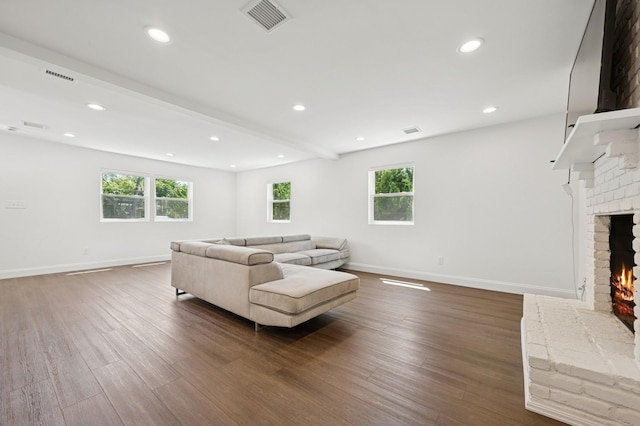 42 Chernucha Ave, Merrick, NY 11566 - living area featuring a fireplace, plenty of natural light, baseboards, wood finished floors, and recessed lighting