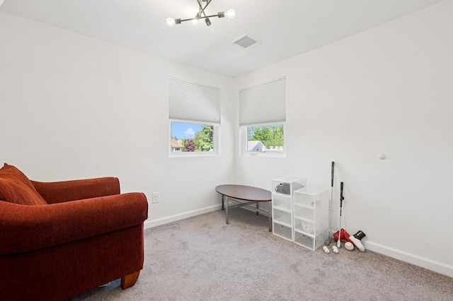 42 Chernucha Ave, Merrick, NY 11566 - living area with carpet floors, a chandelier, and baseboards