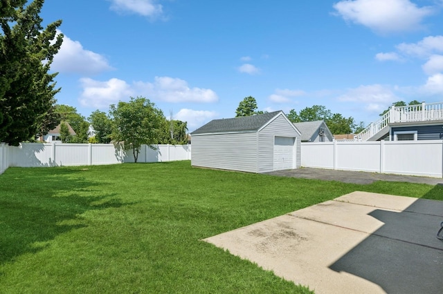 42 Chernucha Ave, Merrick, NY 11566 - view of yard with an outdoor structure and a garage
