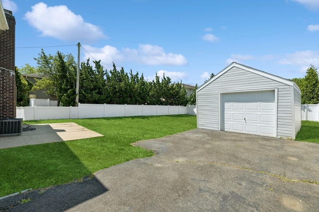 42 Chernucha Ave, Merrick, NY 11566 - view of yard with a detached garage, an outbuilding, driveway, and central AC unit