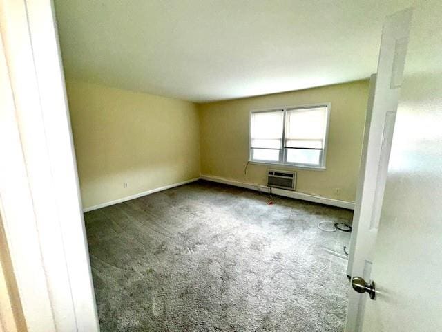 1668 Rte 9 Unit 13E, Wappingers Falls, NY 12590 - spare room with carpet floors, a wall mounted AC, and baseboards