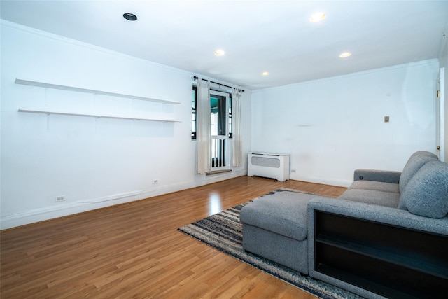 1273 N Ave Unit 5C Building 2, New Rochelle, NY 10804 - living room featuring wood finished floors, recessed lighting, heating unit, and ornamental molding