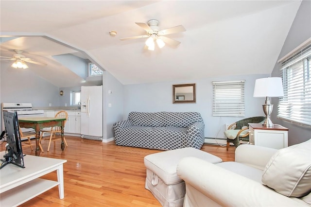 25B Edgewater Park Unit 25B, Bronx, NY 10465 - living room featuring ceiling fan, lofted ceiling, a baseboard heating unit, light wood-style floors, and baseboards