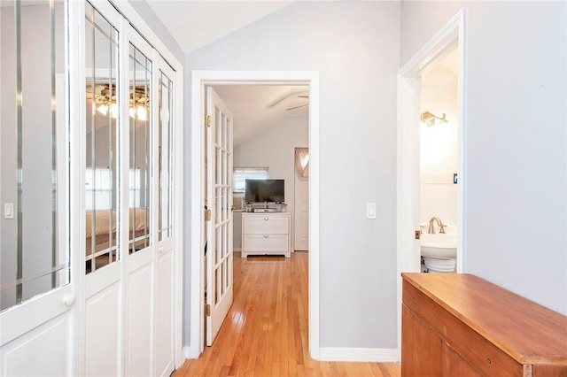 25B Edgewater Park Unit 25B, Bronx, NY 10465 - corridor featuring vaulted ceiling, light wood finished floors, and baseboards