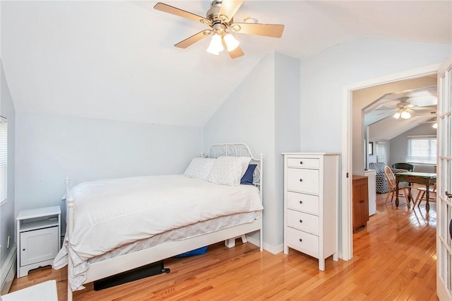 25B Edgewater Park Unit 25B, Bronx, NY 10465 - bedroom with vaulted ceiling, light wood-style flooring, a ceiling fan, and baseboards