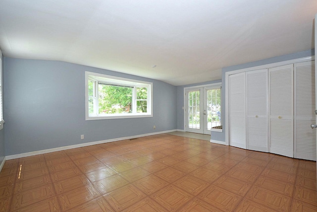 1578 N Thompson Dr, Bay Shore, NY 11706 - unfurnished bedroom featuring vaulted ceiling, french doors, and a closet
